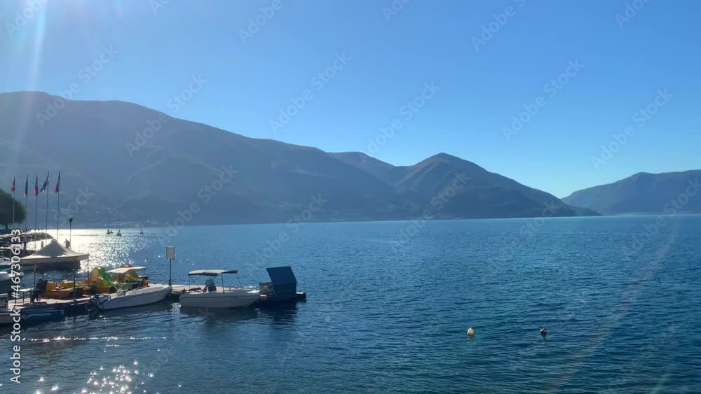Panorama View over Alpine Lake Maggiore with Mountain in a Sunny Day in Ascona, Ticino in Switzerland. Panorama View over Alpine Lake Maggiore with Mountain in a Sunny Day in Ascona, Ticino in Switzerland.