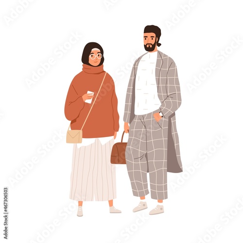 Arab Muslim couple of modern man and woman. Portrait of Arabian female in hij...