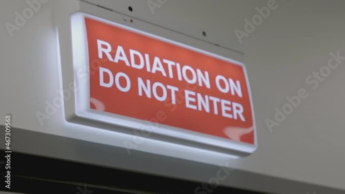 Radiation warning sign on a wall.