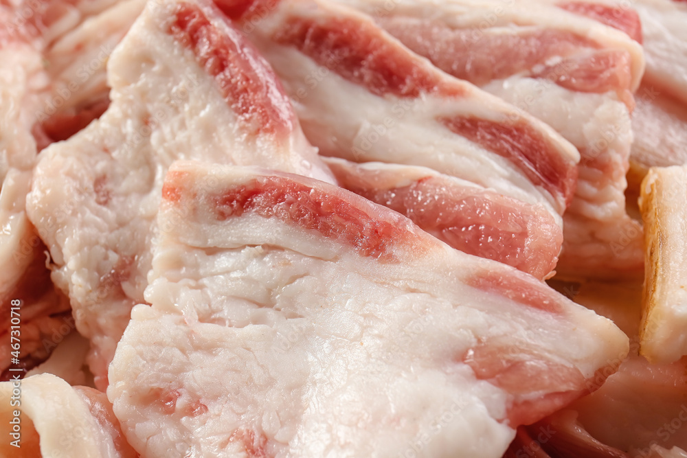 Slices of uncooked bacon as background, closeup Slices of uncooked bacon as background, closeup