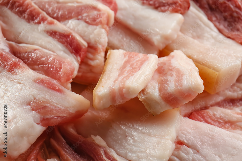Slices of uncooked bacon as background, closeup Slices of uncooked bacon as background, closeup
