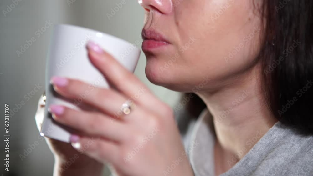 Young woman drinking coffee or tea with turkish delight, close-up shooting. Young woman drinking coffee or tea with turkish delight, close-up shooting.