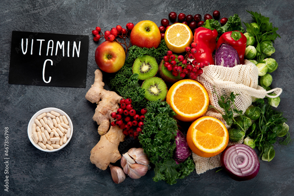 Foods high in vitamin C on dark background. Foods high in vitamin C on dark background.