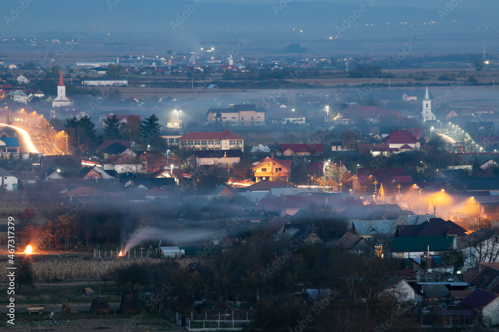 Obraz premium Smoke over rural landscape.
