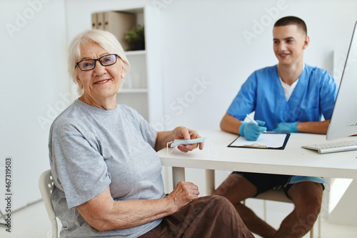 elderly woman sitting in the doctor s office visit to the hospital