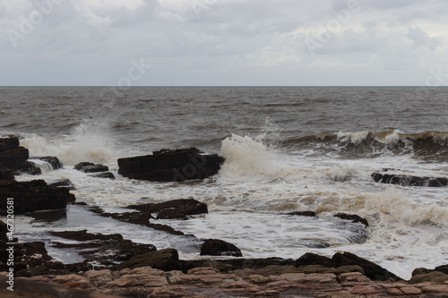 Fototapeta Naklejka Na Ścianę i Meble -  A view of the sea on a embankment of rocks