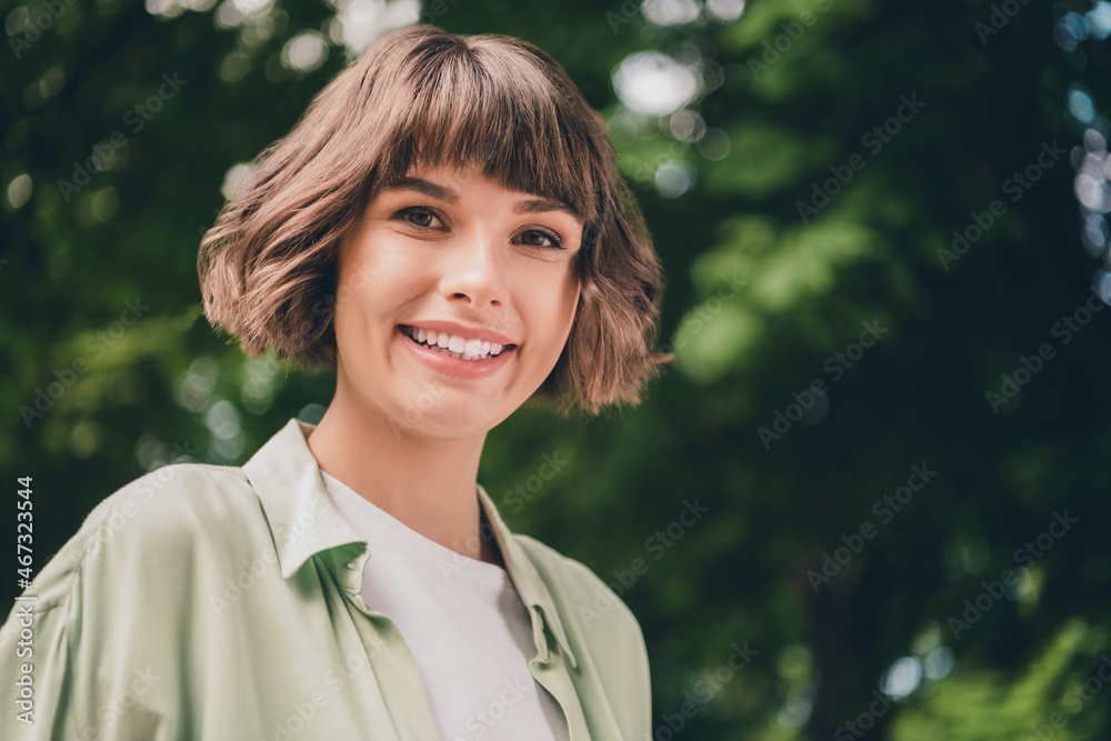 Photo of charming adorable young woman wear green shirt smiling walking outside city street Photo of charming adorable young woman wear green shirt smiling walking outside city street