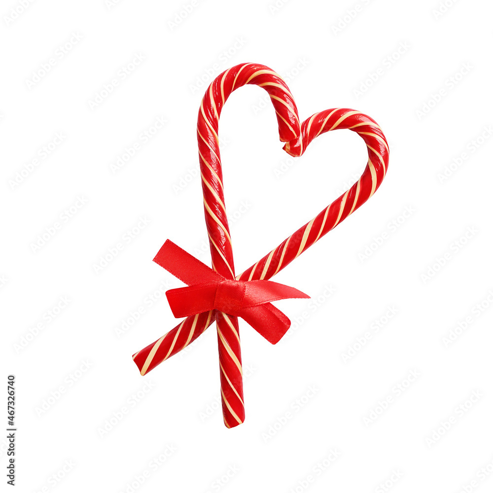 Candy canes heart red ribbon bow isolated white background. Christmas New Year decoration. Candy canes heart red ribbon bow isolated white background. Christmas New Year decoration.