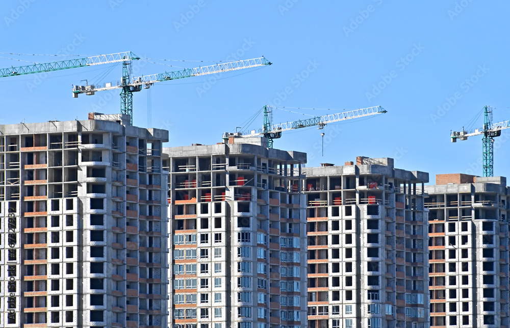 Crane and highrise construction site Crane and highrise construction site