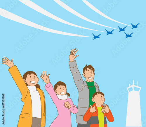 航空祭で飛行機に手を振る家族