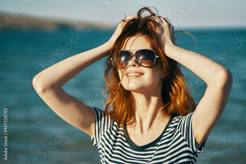 cheerful woman wearing sunglasses travel walk summer freedom © SHOTPRIME STUDIO