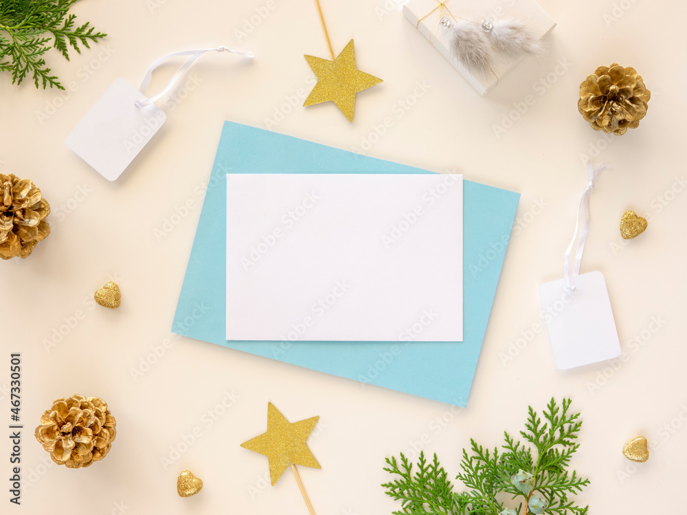 Online winter sales banner mockup. Christmas border frame with an empty letter for promo text. Blank card with xmas branch and pine cones. New year flat lay, top view, copy space Online winter sales banner mockup. Christmas border frame with an empty letter for promo text. Blank card with xmas branch and pine cones. New year flat lay, top view, copy space