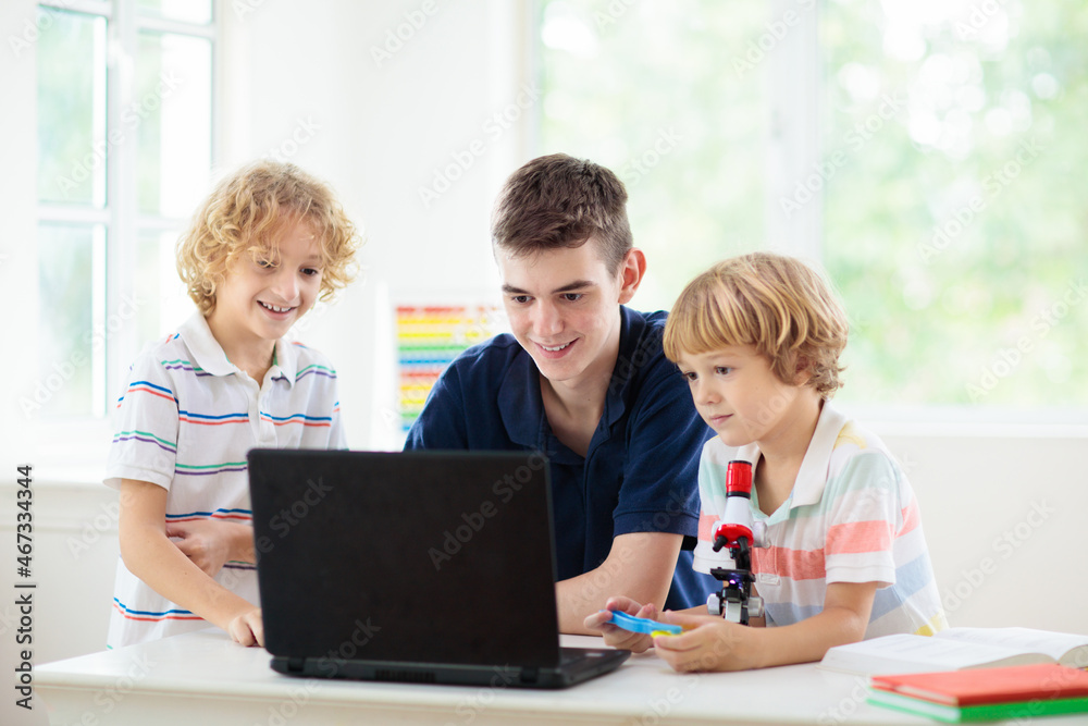 School kids with microscope. Science class. School kids with microscope. Science class.
