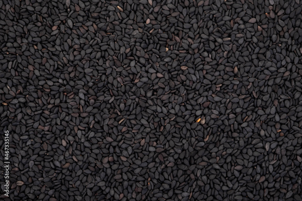 Black sesame seeds organic on white background. Health food concept. Black sesame seeds organic on white background. Health food concept.