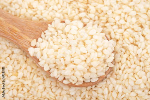 white sesame seeds organic on white background. Health food concept.