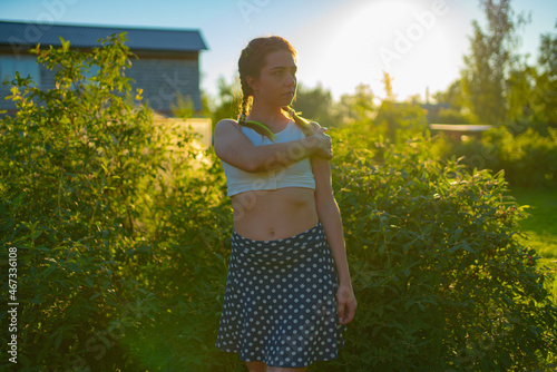 Woman model poses for a photographer in nature