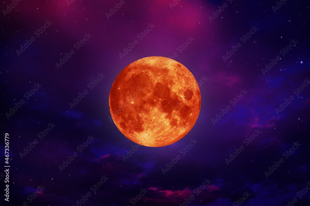 blood moon concept of a red full moon in black sky with cloud.