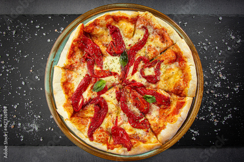 Pizza with smoked bell pepper, tomatoes and herbs