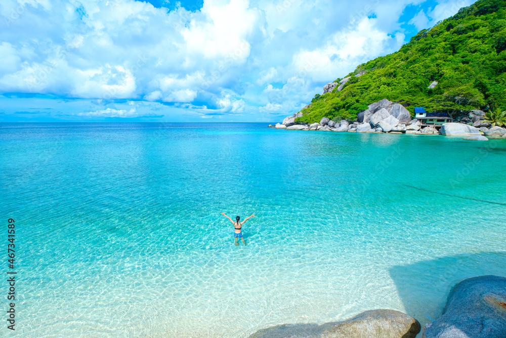 Fototapeta premium the woman on the beach, clear water sea with blue sky on the Holiday, swim on the turquoise water beach, at koh nang yuan island beach, koh tao ,suratthani , thailand
