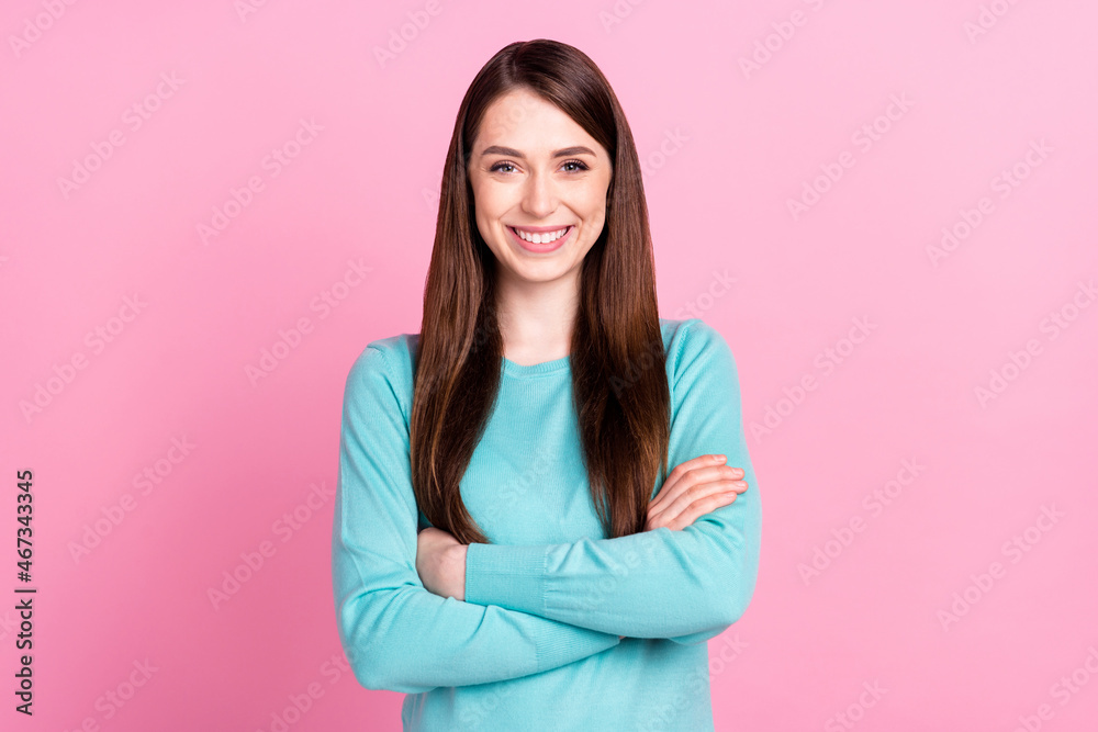 Photo of happy confident young woman hold hands crossed good mood isolated on pink color background Photo of happy confident young woman hold hands crossed good mood isolated on pink color background