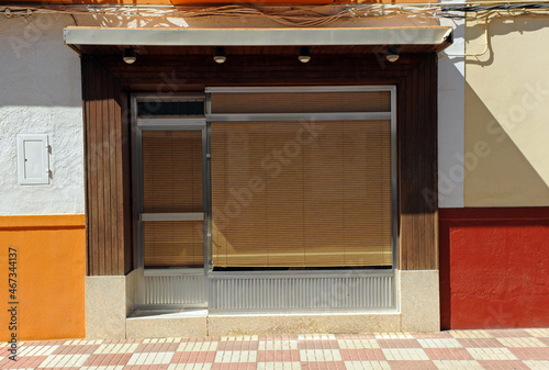 Tienda cerrada con diseño al estilo de los años setenta del siglo XX en Calzada de Calatrava, pueblo natal de Pedro Almodóvar. Pueblos de Ciudad Real, Castilla la Mancha, España photo