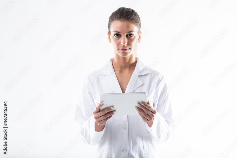 Attractive young female doctor or nurse holding a tablet-pc Attractive young female doctor or nurse holding a tablet-pc