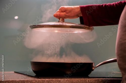 saucepan with steam and lid
