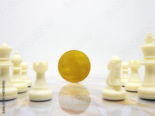 Golden coin with chess isolated,Business concept