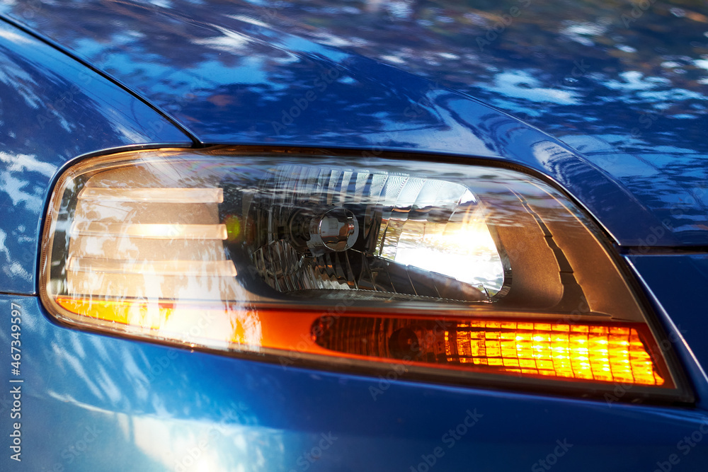 Close up view of car headlight. Lamp of modern car headlight.