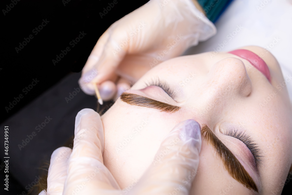macro photography of the model's eyebrows painted and applied eyebrow