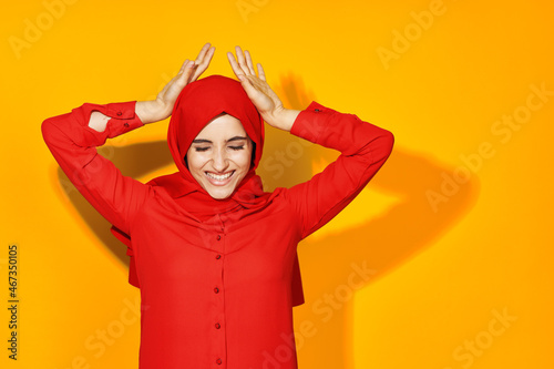 pretty woman posing smile fashion yellow background © VICHIZH