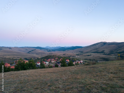 View from the lookout on Šumatno hill on the mountain landscapes of Zlatibor and the tourist building in the autumn at dusk