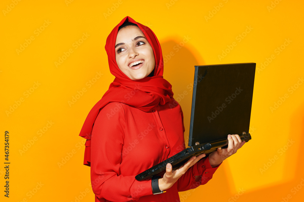 arab woman laptop posing technology internet yellow background