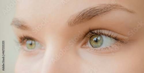 Close-up of bright green eyes of a girl.