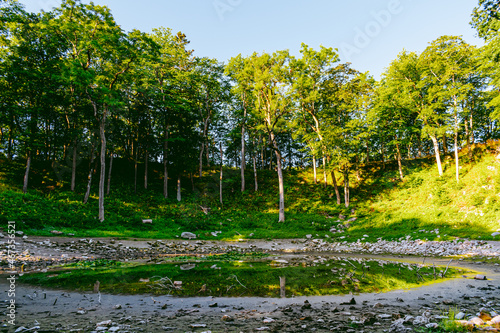 Kaali field of meteorite craters in Saaremaa, Estonia during sunny summer morning