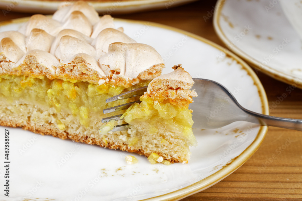 Closeup piece of homemade pie decorated with meringue. Shallow focus. Closeup piece of homemade pie decorated with meringue. Shallow focus.