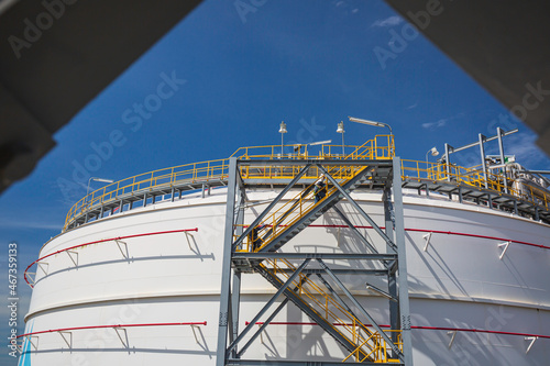 Male walking the up stairway inspection propane tank.