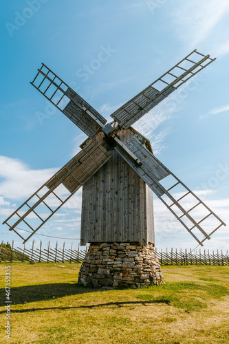 Wooden windmill with a stone base in the Angla Windmill Park in Saaremaa, Estonia. photo