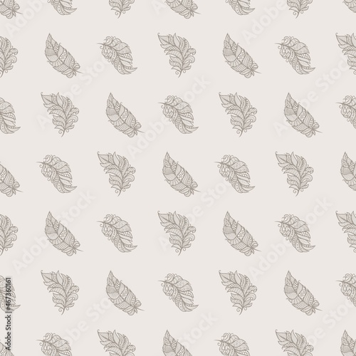 Seamless pattern with decorative feathers. Openwork grey leaves on a beige background. Template for fabrics, wallpaper, textiles, clothes, pillows, bed linen. Light pastel colors. Vector illustration.