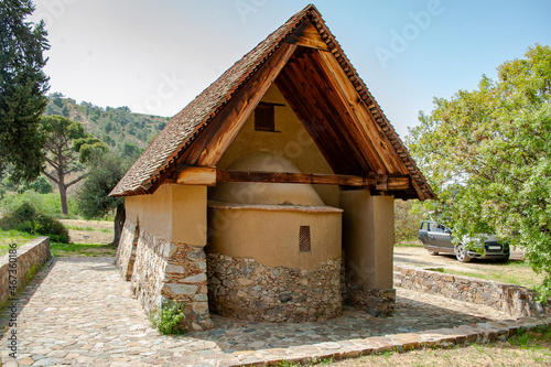 Cyprus  Troodos Mountains  mountain village  cultural tradition  rural architecture  stone house  wooden balcony  stone paved street  potted flowers  hedge  floristry  hiking  travel  tourism      