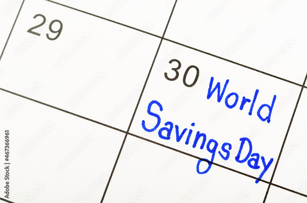 World savings day marked on a white calendar. World savings day marked on a white calendar.