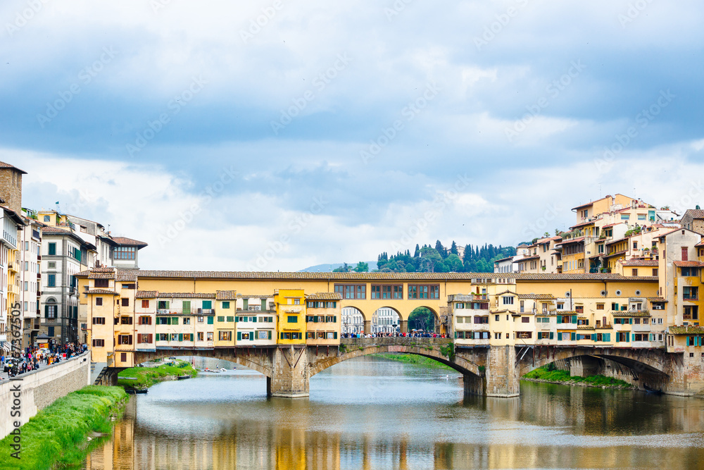 huge crowds of people on the Ponte Vecchio, Florence, Italy. Spring cloudy day