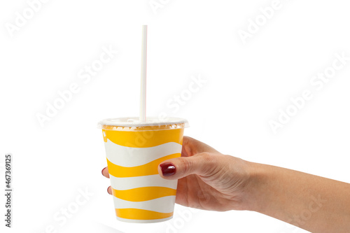 girl holds paper disposable glass with tube isolated on white background