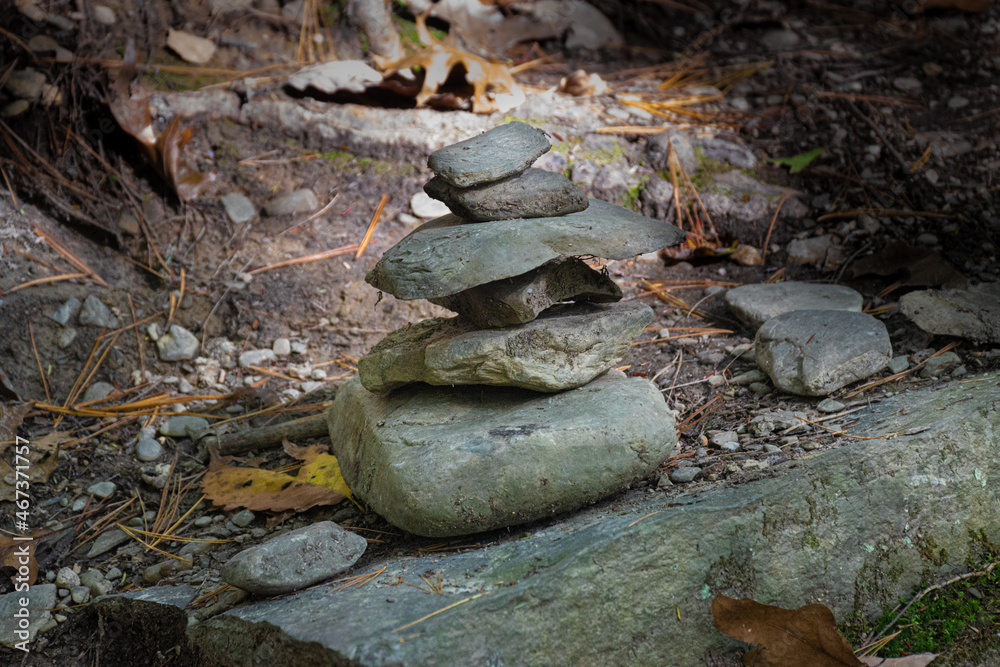 Setting Sun lights these small Cairns stacked along the trail at Watkins Glen State Park in Upstate NY Setting Sun lights these small Cairns stacked along the trail at Watkins Glen State Park in Upstate NY