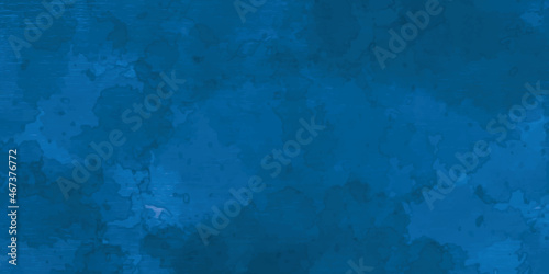 Grunge classic blue concrete background. Textured plaster wall. Creative backdrop for your design. Color of the year 2020 concept. Top view, layout for design. Surface with peeling shabby pattern.