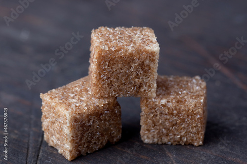 rope sugar in cubes close-up on a wooden background