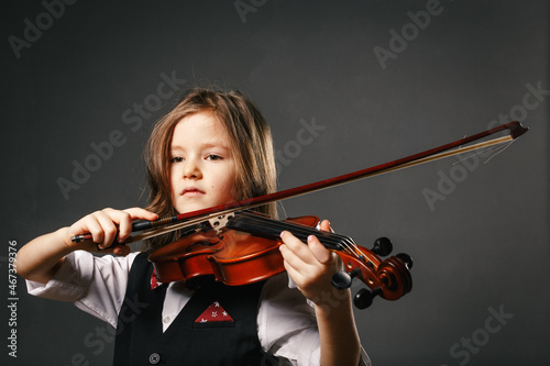 Young girl closeup studio portrait with violin