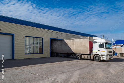 A large lorry stands at the terminal for loading and unloading goods and cargo