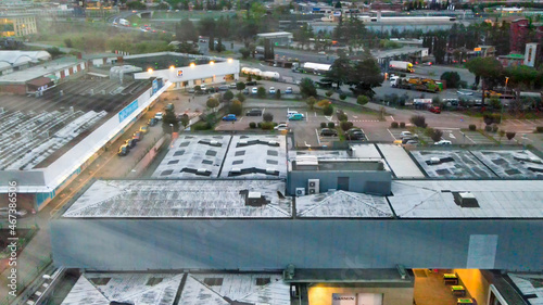 Aerial view of shopping center area at sunset.