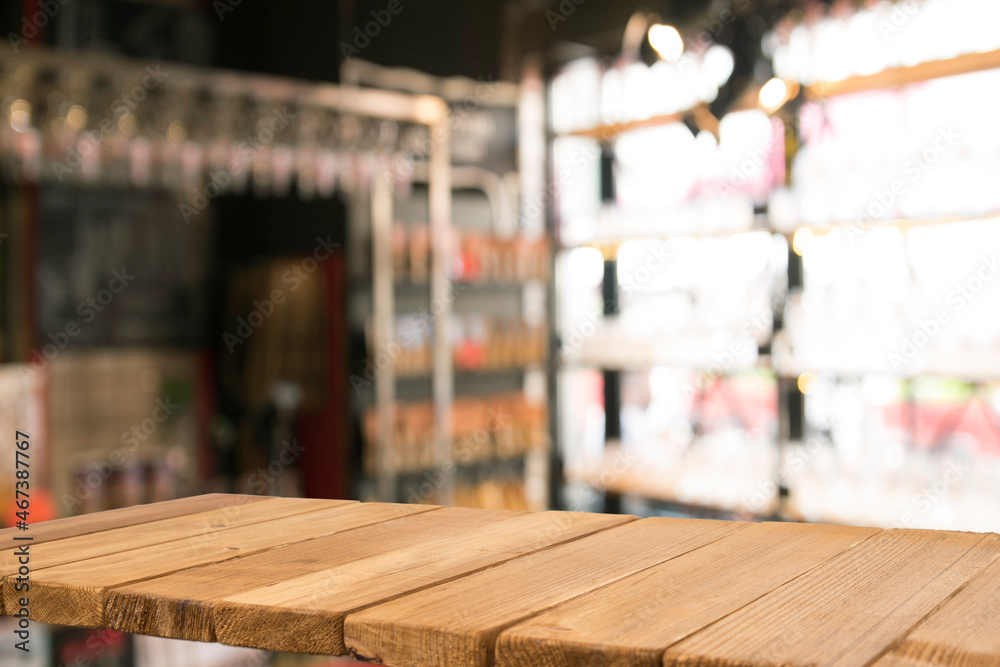 Empty dark wooden table in front of abstract blurred bokeh background of restaurant . can be used for display or montage your products.Mock up for space Empty dark wooden table in front of abstract blurred bokeh background of restaurant . can be used for display or montage your products.Mock up for space